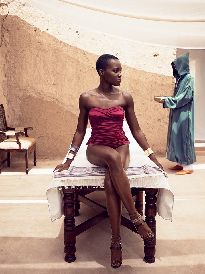 Lady in Red Lupita Nyong’o wearing a J.Crew swimsuit, Yossi Harari cuffs, and Casadei for Prabal Gurung heels. On set in Marrakech. Photographed by Mikael Jansson, Vogue, July 2014